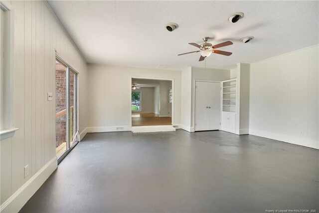 2619 Dumfries Dr, Fayetteville, NC 28306 - empty room with ceiling fan, finished concrete flooring, and wooden walls