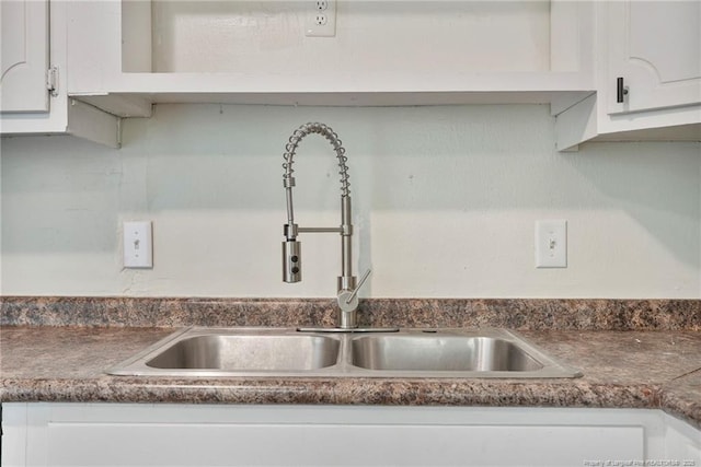 2619 Dumfries Dr, Fayetteville, NC 28306 - kitchen view of white cabinets and dark countertops