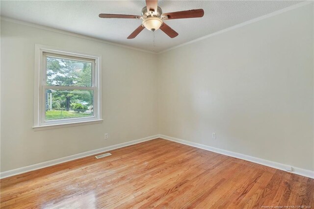 2619 Dumfries Dr, Fayetteville, NC 28306 - unfurnished room with light wood-style flooring, crown molding, and a ceiling fan