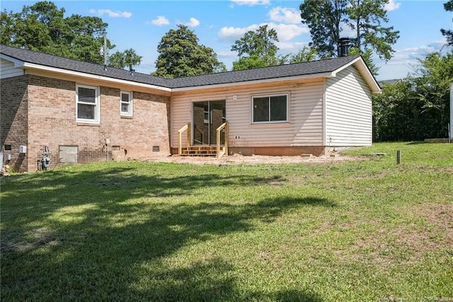 2619 Dumfries Dr, Fayetteville, NC 28306 - back of property with entry steps, a lawn, brick siding, and crawl space