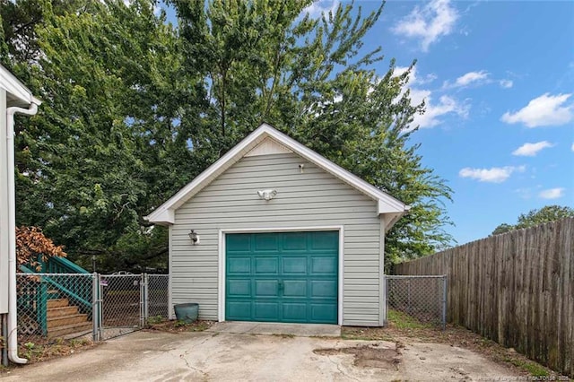 3464 Mcchoen Dr, Fayetteville, NC 28311 - detached garage with concrete driveway and a gate
