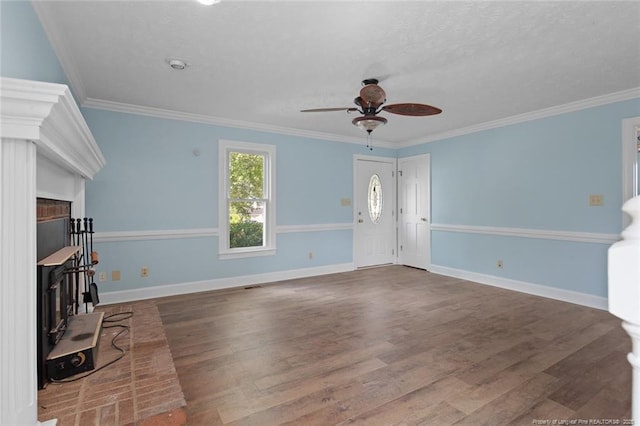 3464 Mcchoen Dr, Fayetteville, NC 28311 - unfurnished living room with ceiling fan, ornamental molding, wood finished floors, a textured ceiling, and a fireplace
