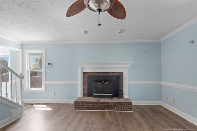 3464 Mcchoen Dr, Fayetteville, NC 28311 - unfurnished living room featuring wood finished floors, stairs, a ceiling fan, crown molding, and a textured ceiling