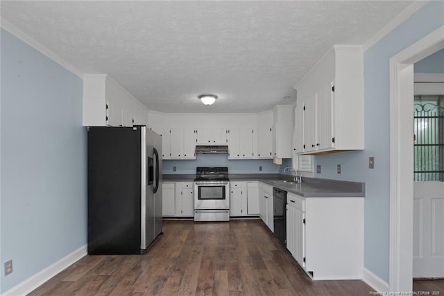 3464 Mcchoen Dr, Fayetteville, NC 28311 - kitchen with appliances with stainless steel finishes, under cabinet range hood, dark wood-type flooring, a textured ceiling, and white cabinetry