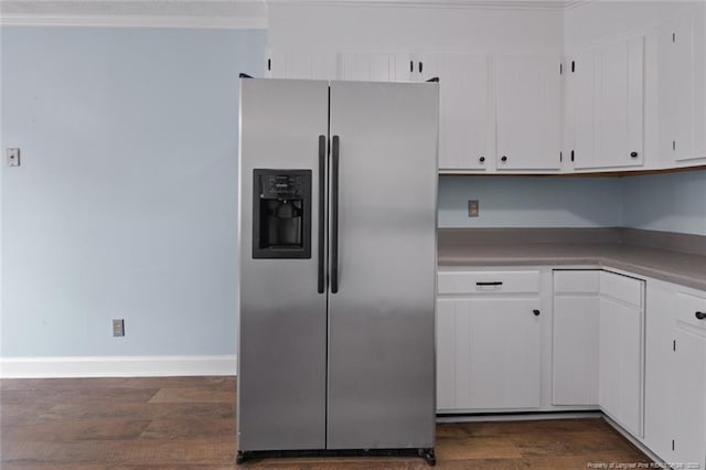 3464 Mcchoen Dr, Fayetteville, NC 28311 - kitchen with stainless steel fridge, crown molding, dark wood-style floors, white cabinetry, and light countertops