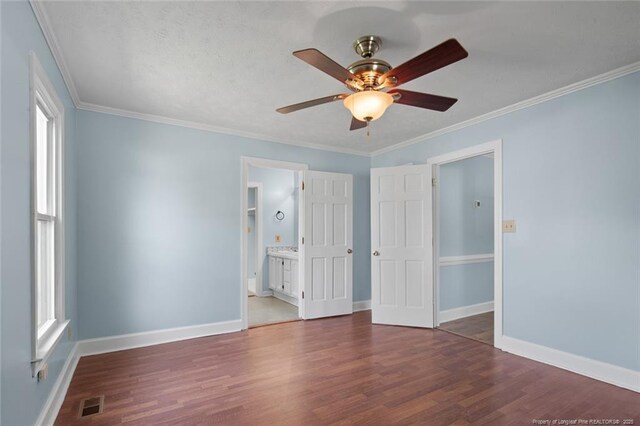 3464 Mcchoen Dr, Fayetteville, NC 28311 - unfurnished bedroom featuring wood finished floors, ornamental molding, ensuite bath, and a ceiling fan