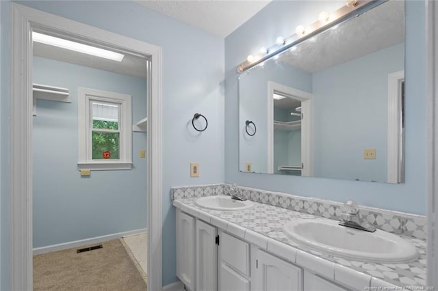 3464 Mcchoen Dr, Fayetteville, NC 28311 - full bath with double vanity and baseboards