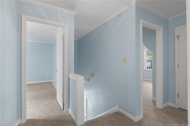 3464 Mcchoen Dr, Fayetteville, NC 28311 - corridor with an upstairs landing, carpet floors, ornamental molding, and a textured ceiling