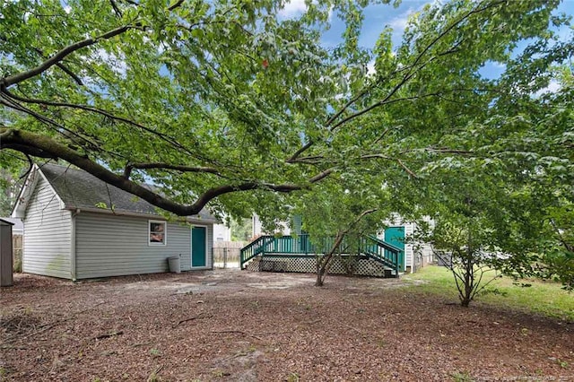 3464 Mcchoen Dr, Fayetteville, NC 28311 - view of yard with a wooden deck and an outdoor structure