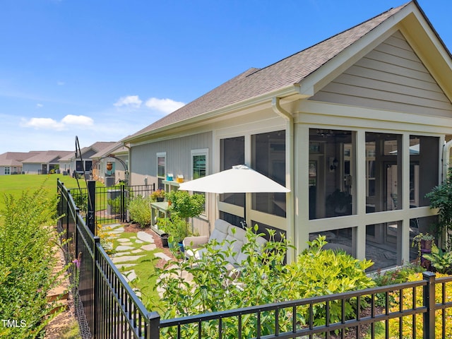 1372 Prevenient Dr, Wake Forest, NC 27587 - view of home's exterior with roof with shingles, a sunroom, and a residential view