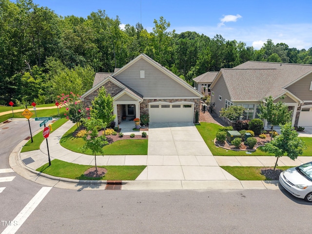 1372 Prevenient Dr, Wake Forest, NC 27587 - craftsman inspired home with stone siding, an attached garage, driveway, and a front yard