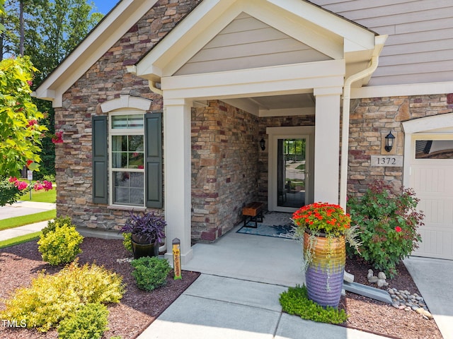 1372 Prevenient Dr, Wake Forest, NC 27587 - property entrance with stone siding and a porch