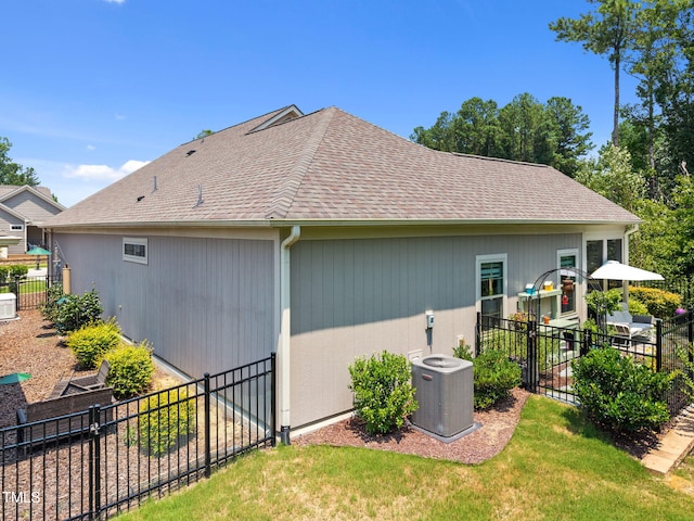 1372 Prevenient Dr, Wake Forest, NC 27587 - view of property exterior featuring a central air condition unit and roof with shingles