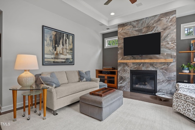 1372 Prevenient Dr, Wake Forest, NC 27587 - living area with crown molding, a premium fireplace, wood finished floors, ceiling fan, and recessed lighting