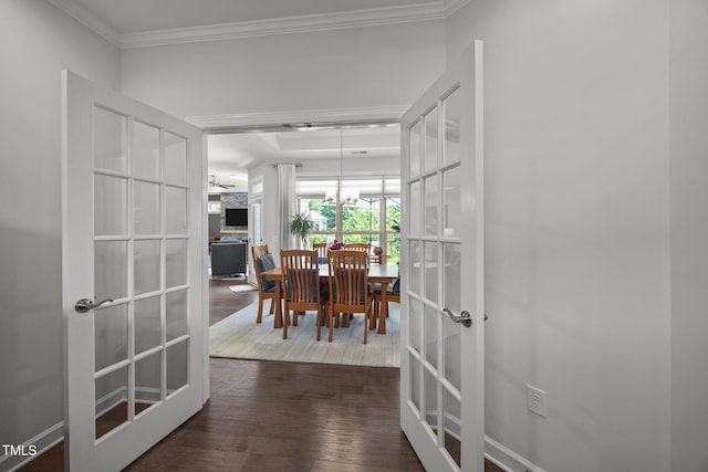 1372 Prevenient Dr, Wake Forest, NC 27587 - corridor featuring french doors, crown molding, a chandelier, and wood finished floors