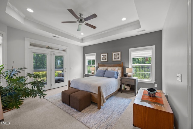 1372 Prevenient Dr, Wake Forest, NC 27587 - bedroom featuring a tray ceiling, access to exterior, carpet, multiple windows, and crown molding