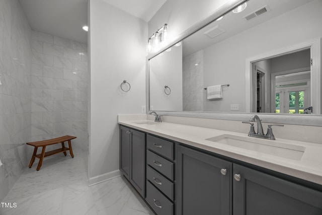 1372 Prevenient Dr, Wake Forest, NC 27587 - full bath with marble look tile flooring, double vanity, and a walk in shower