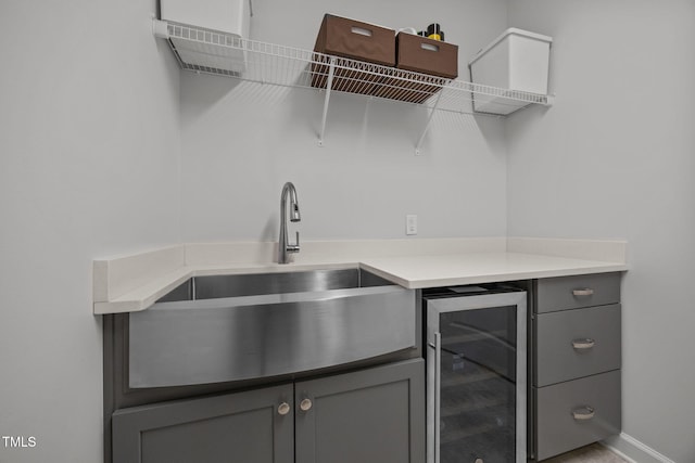 1372 Prevenient Dr, Wake Forest, NC 27587 - bar area featuring wine cooler and a sink