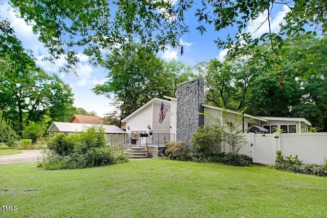 308 Spring Creek Rd, Goldsboro, NC 27534 - view of home's exterior with a chimney and a gate