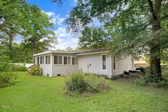 308 Spring Creek Rd, Goldsboro, NC 27534 - back of house featuring crawl space, a yard, and a sunroom