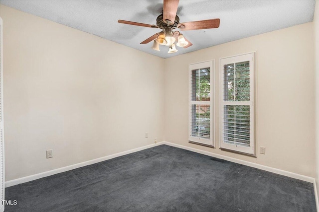 308 Spring Creek Rd, Goldsboro, NC 27534 - spare room featuring dark carpet and ceiling fan