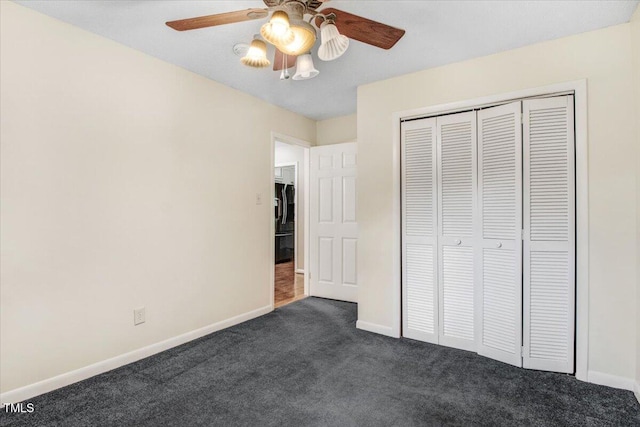 308 Spring Creek Rd, Goldsboro, NC 27534 - unfurnished bedroom with dark colored carpet, a closet, and a ceiling fan