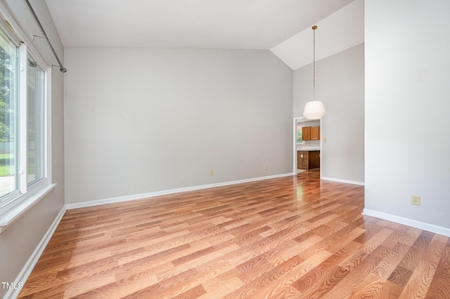 6 Blake Ct, Durham, NC 27712 - empty room featuring plenty of natural light, light wood-style floors, and high vaulted ceiling