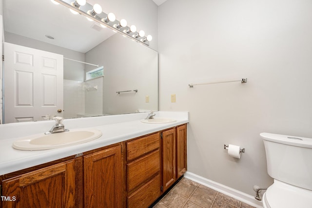 6 Blake Ct, Durham, NC 27712 - full bath featuring a tile shower, double vanity, and tile patterned floors