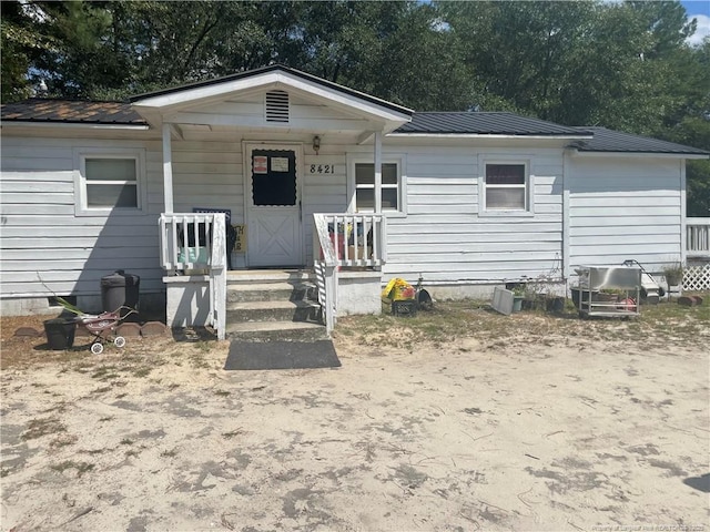 8421 Cedar Creek Rd, Fayetteville, NC 28312 - view of front of home featuring a metal roof, covered porch, and crawl space