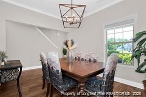 341 Woodington Rd, Hope Mills, NC 28348 - dining space featuring wood finished floors, a chandelier, and crown molding
