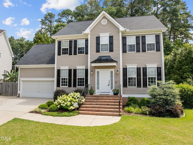 1802 Abby Knoll Dr, Apex, NC 27502 - colonial inspired home with concrete driveway, an attached garage, a shingled roof, and entry steps