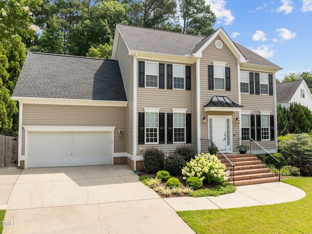 1802 Abby Knoll Dr, Apex, NC 27502 - colonial-style house featuring concrete driveway, a garage, and roof with shingles