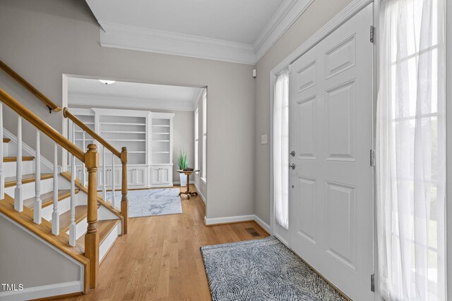 1802 Abby Knoll Dr, Apex, NC 27502 - foyer entrance featuring crown molding, light wood-type flooring, and stairway