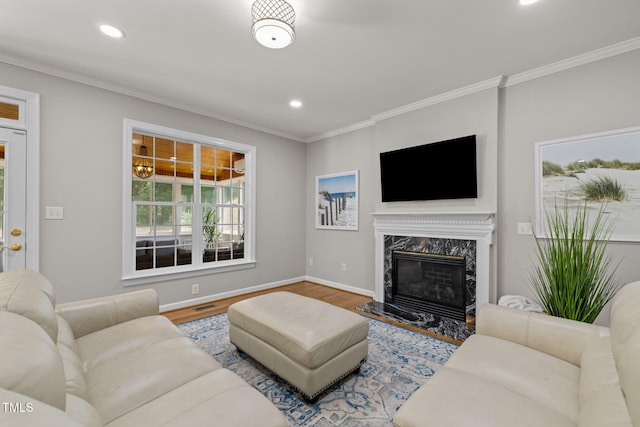 1802 Abby Knoll Dr, Apex, NC 27502 - living area featuring recessed lighting, wood finished floors, ornamental molding, and a premium fireplace