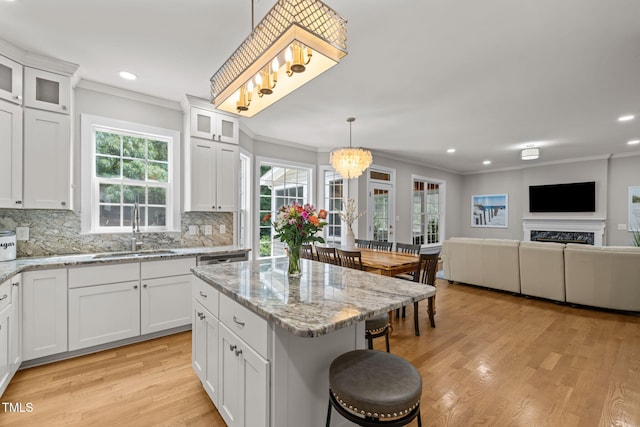 1802 Abby Knoll Dr, Apex, NC 27502 - kitchen with crown molding, light wood finished floors, tasteful backsplash, recessed lighting, and plenty of natural light