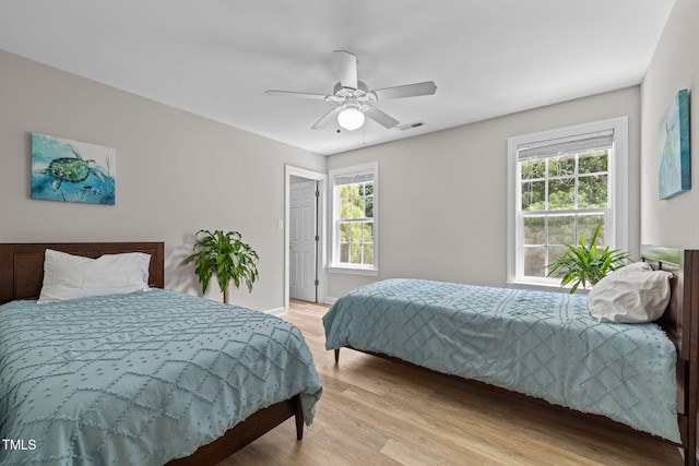 1802 Abby Knoll Dr, Apex, NC 27502 - bedroom featuring light wood-type flooring and a ceiling fan