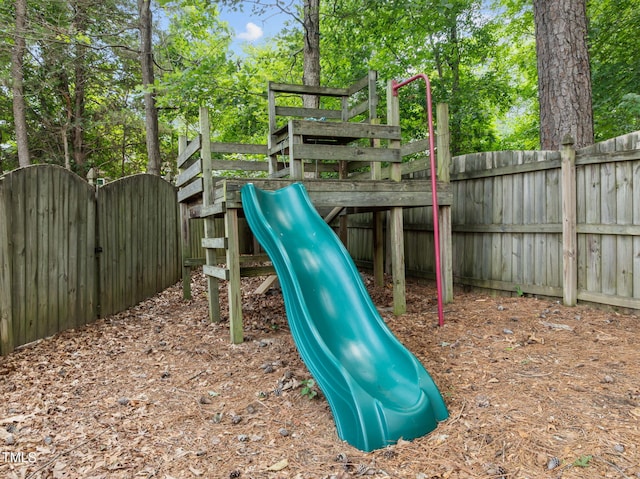 1802 Abby Knoll Dr, Apex, NC 27502 - view of playground featuring a gate and view of wooded area