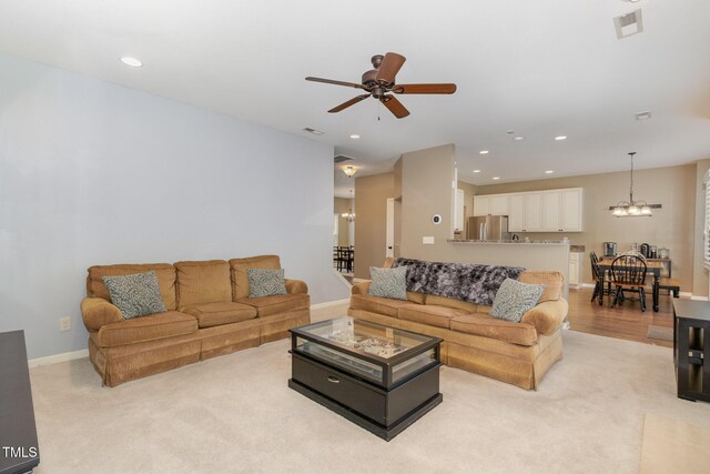 118 Truss Way, Durham, NC 27704 - living room with a chandelier, ceiling fan, recessed lighting, and light colored carpet