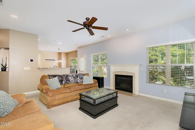 118 Truss Way, Durham, NC 27704 - carpeted living area with a ceiling fan, recessed lighting, and a glass covered fireplace
