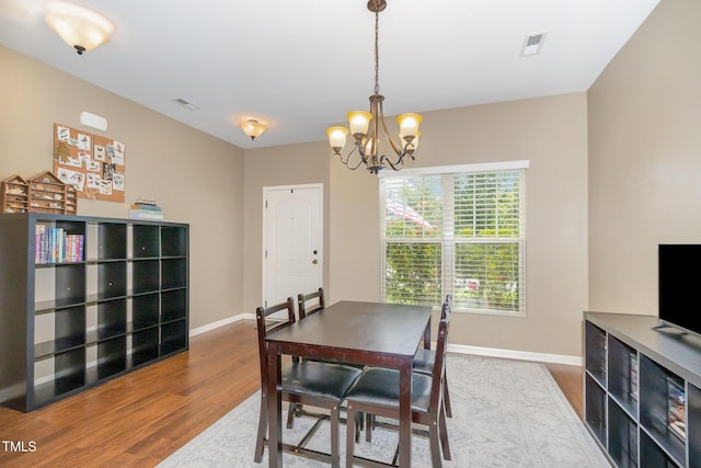 118 Truss Way, Durham, NC 27704 - dining area featuring wood finished floors and a chandelier