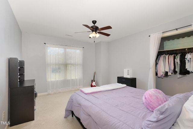118 Truss Way, Durham, NC 27704 - bedroom with light colored carpet, a closet, and a ceiling fan