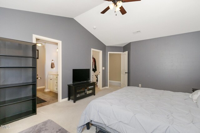 118 Truss Way, Durham, NC 27704 - carpeted bedroom featuring lofted ceiling, a ceiling fan, ensuite bathroom, and a walk in closet