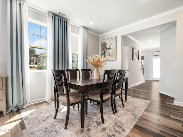 1650 Singing Bird Trl, Wake Forest, NC 27587 - dining area with wood finished floors, ornamental molding, and recessed lighting