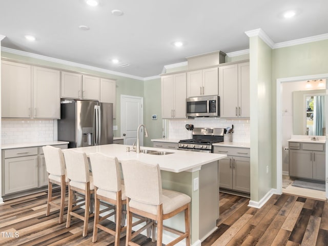 1650 Singing Bird Trl, Wake Forest, NC 27587 - kitchen featuring stainless steel appliances, gray cabinetry, crown molding, tasteful backsplash, and dark wood-style flooring