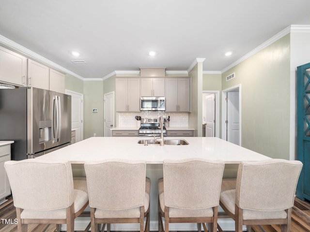 1650 Singing Bird Trl, Wake Forest, NC 27587 - kitchen with appliances with stainless steel finishes, tasteful backsplash, light countertops, ornamental molding, and dark wood-style flooring