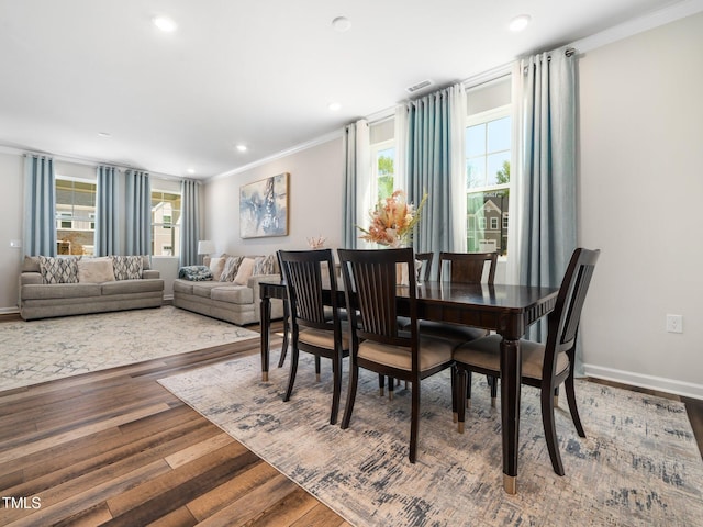1650 Singing Bird Trl, Wake Forest, NC 27587 - dining space featuring ornamental molding, wood finished floors, and recessed lighting