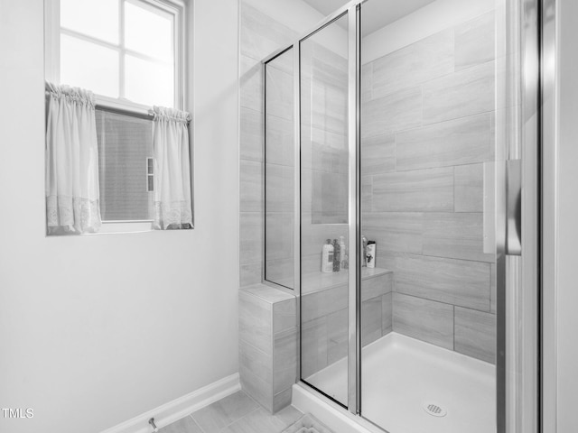 1650 Singing Bird Trl, Wake Forest, NC 27587 - bathroom featuring a stall shower and baseboards