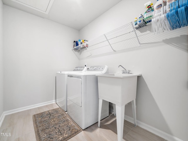 1650 Singing Bird Trl, Wake Forest, NC 27587 - laundry room with separate washer and dryer and light wood-style flooring