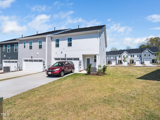 1650 Singing Bird Trl, Wake Forest, NC 27587 - back of property with a garage, driveway, and a lawn