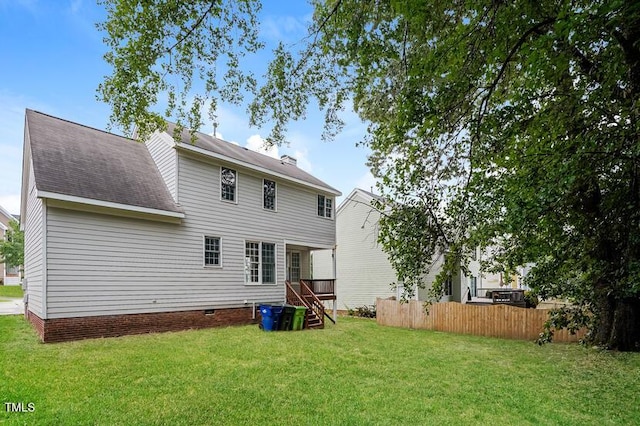 413 Hanska Way, Raleigh, NC 27610 - back of house with a shingled roof and crawl space